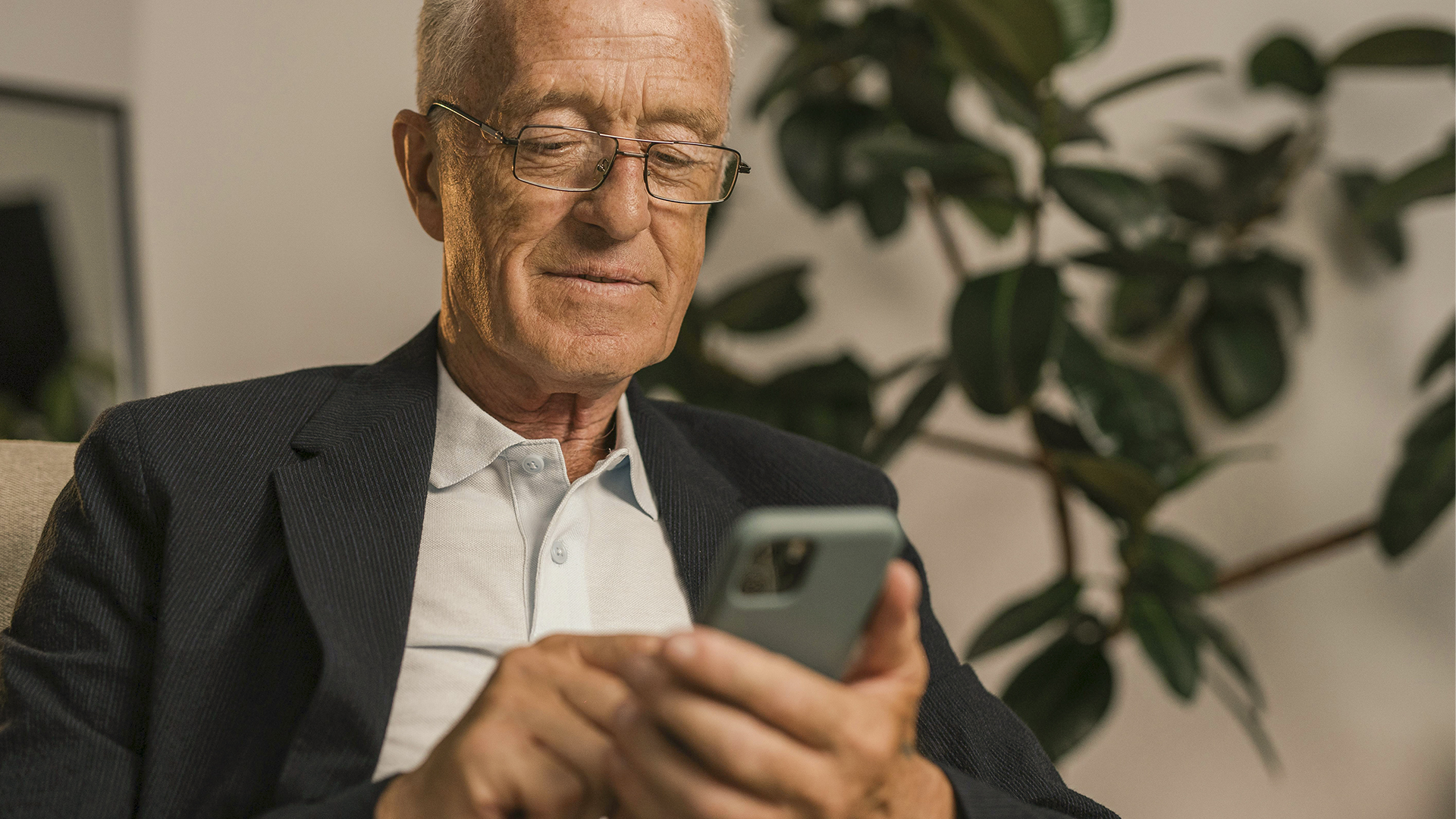 Photo of a senior checking the Veracash app on their mobile