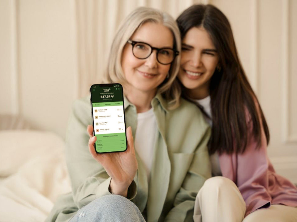 Mother and daughter checking their Veracash account on the mobile app